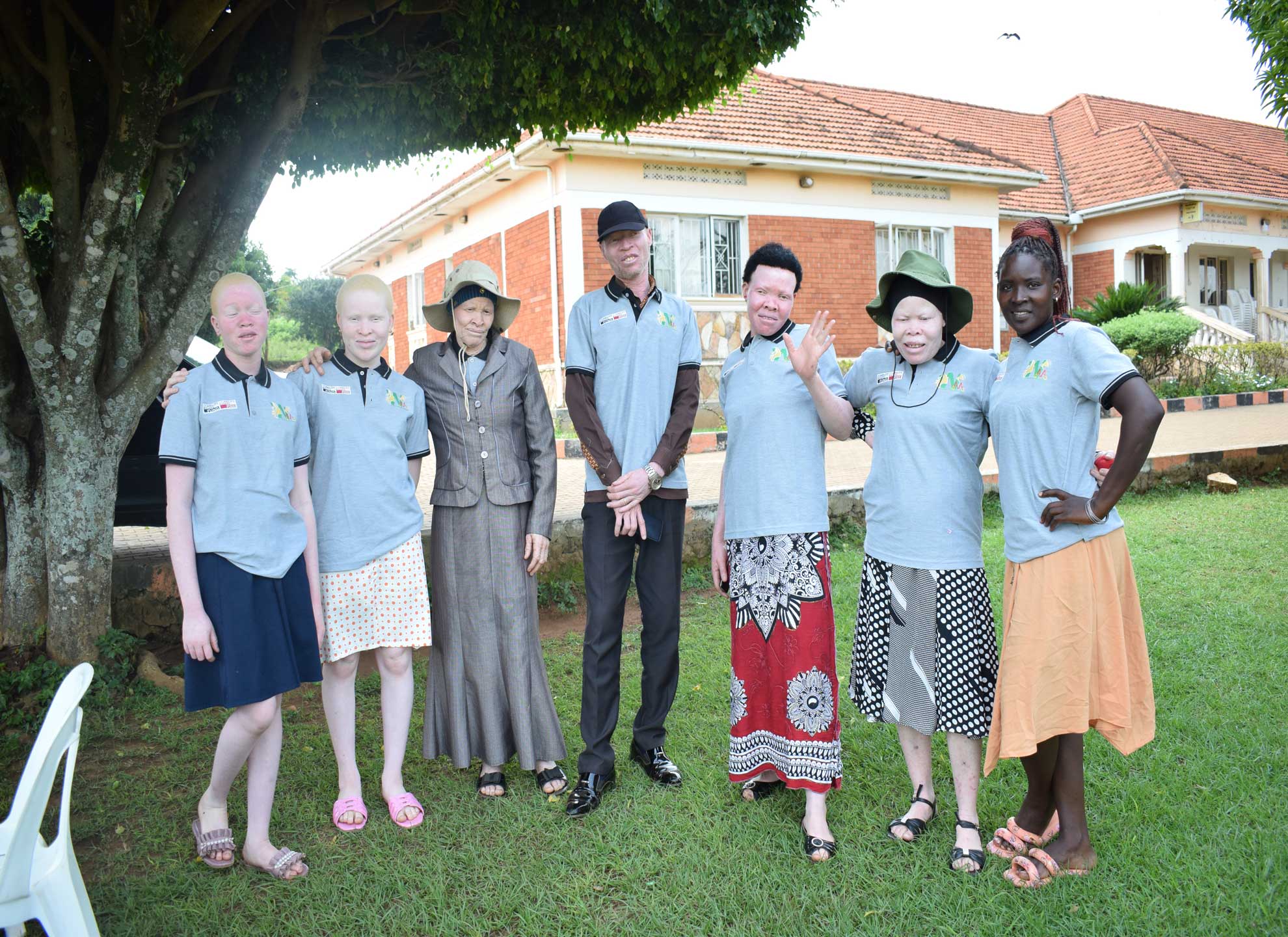 women-and-girls-with-albinism,-Co--Opted-member,-and-a-parent-pose-for-a-group-photo-after-the-engagement-meeting-with-DEC-and-TPC-members2